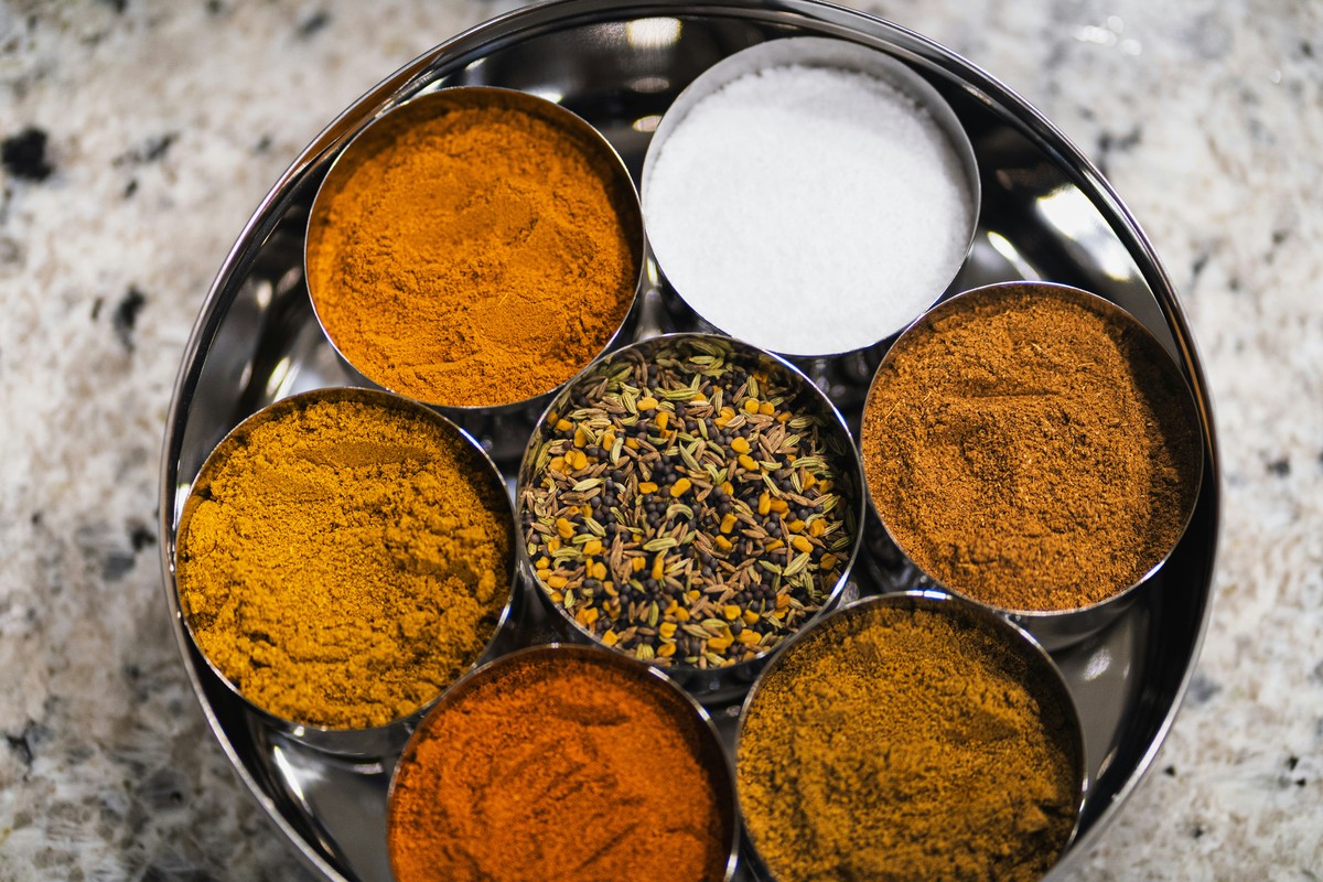 Masala dabba with turmeric, cumin, garam masala and coriander.