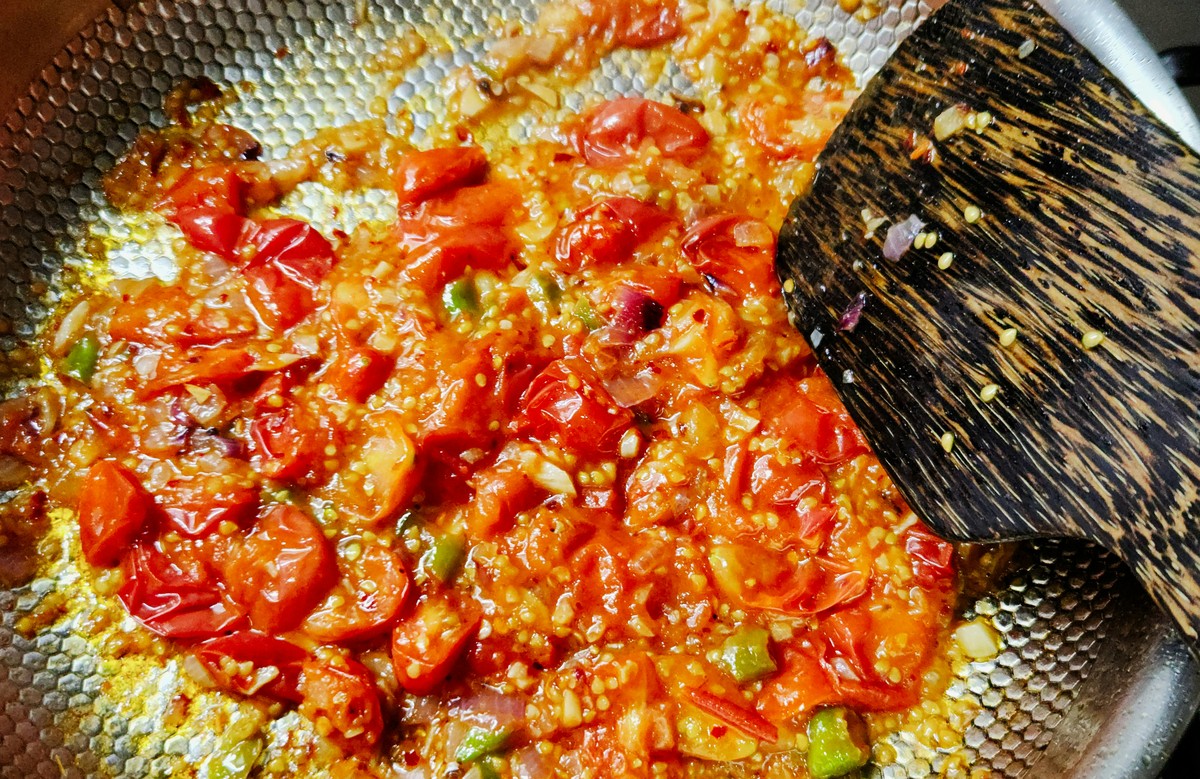 Jammy tomato and spice base in a pan, step 5.
